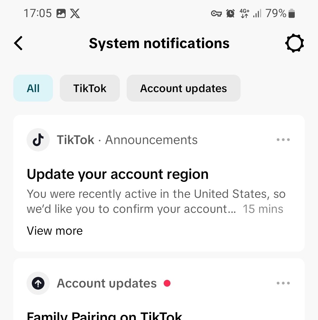 TikTok system notification prompting to update account region after being active in the United States.